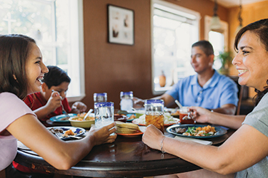 Minerva Quezada eating with her family.